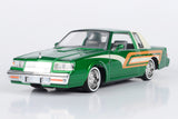 Motormax Get Low Series 1987 Buick Regal 3.8 SFI Turbo Green Metallic and Cream with Graphics Lowrider 1:24 Diecast Model 79023