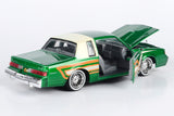 Motormax Get Low Series 1987 Buick Regal 3.8 SFI Turbo Green Metallic and Cream with Graphics Lowrider 1:24 Diecast Model 79023