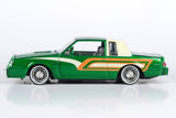 Motormax Get Low Series 1987 Buick Regal 3.8 SFI Turbo Green Metallic and Cream with Graphics Lowrider 1:24 Diecast Model 79023